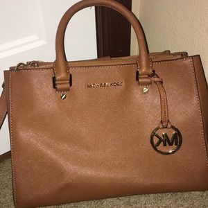 Light brown Micheal kors purse